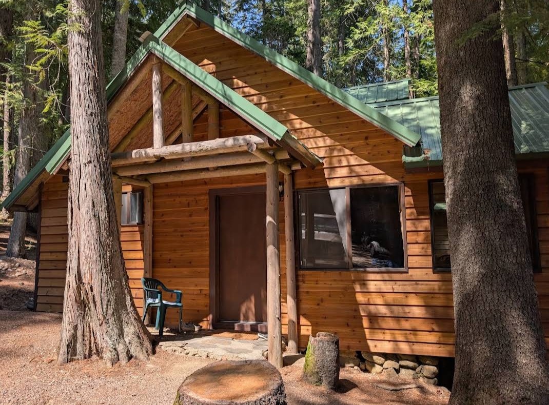 Cabin rebuilt after storm damage — dining room, roof, and deck restored